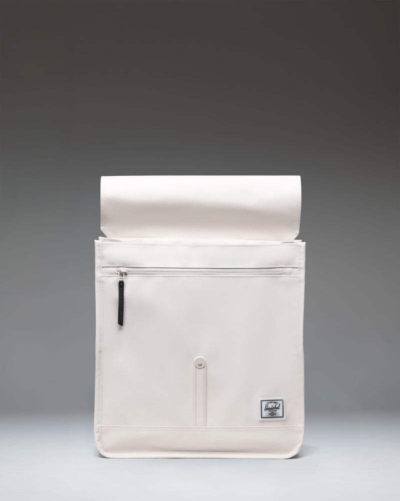 Herschel Supply Co. City Backpack in Moonbeam Tonal featuring a streamlined design, a single front strap closure, and a clean minimalist look.