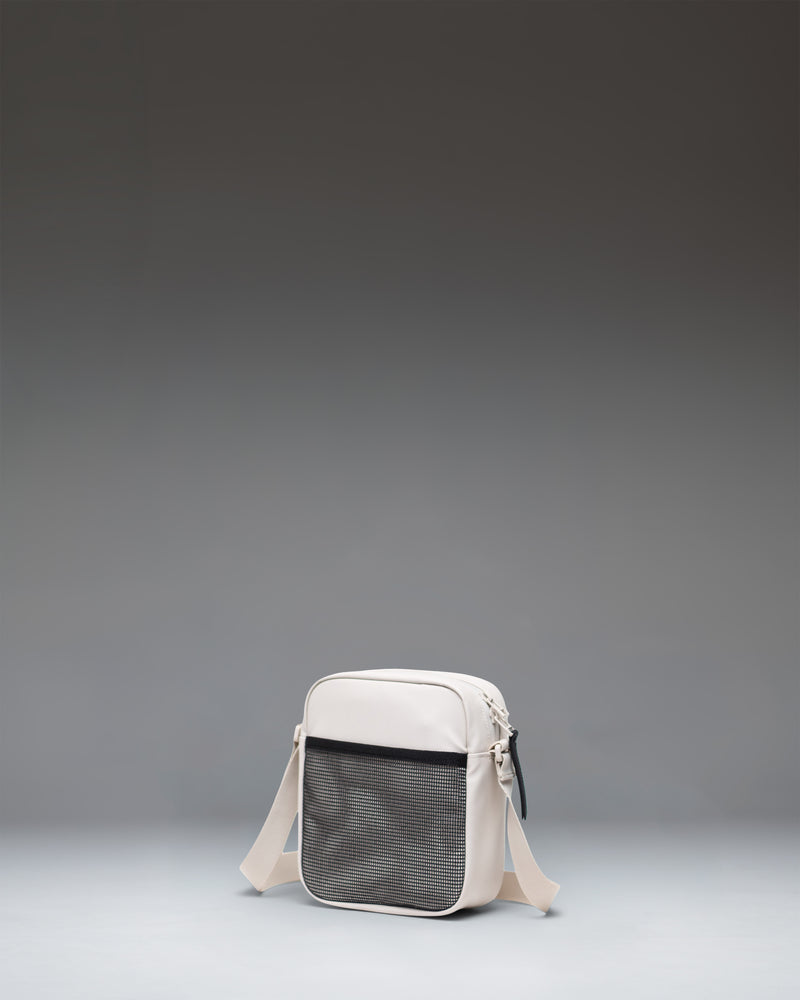 Herschel Heritage Crossbody bag in Moonbeam Tonal, showing the front view with zipper detail.