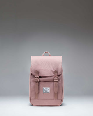 Herschel Retreat Mini Backpack in Ash Rose, a dusty pink color, featuring a drawstring closure and a single magnetic strap.