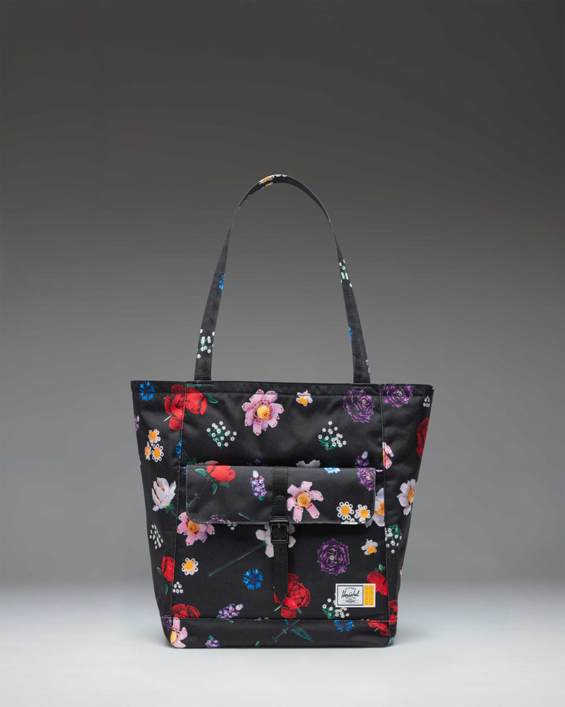 Herschel Supply Co. LEGO Retreat Tote bag in Falling Florals print featuring a black background with vibrant pink, yellow, and green flowers.