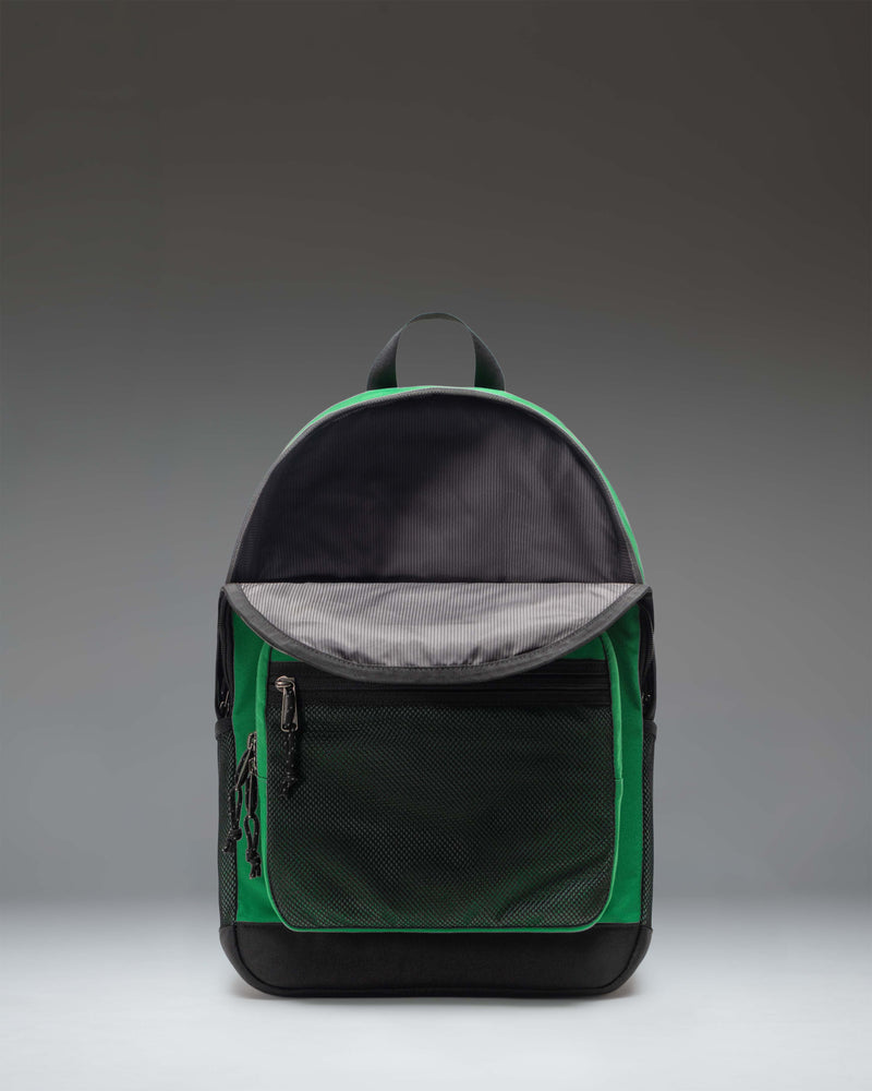 Herschel Supply Co. Kaine Backpack in Varsity Pine green, showing a detailed close-up of the front zippered pockets and durable design.