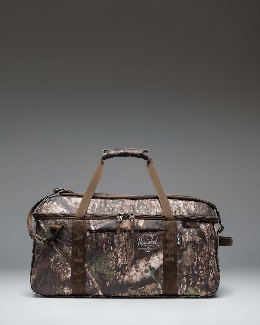 Herschel Supply Co. Realtree All Season Duffle 41L bag featuring the Realtree APX Camo pattern.