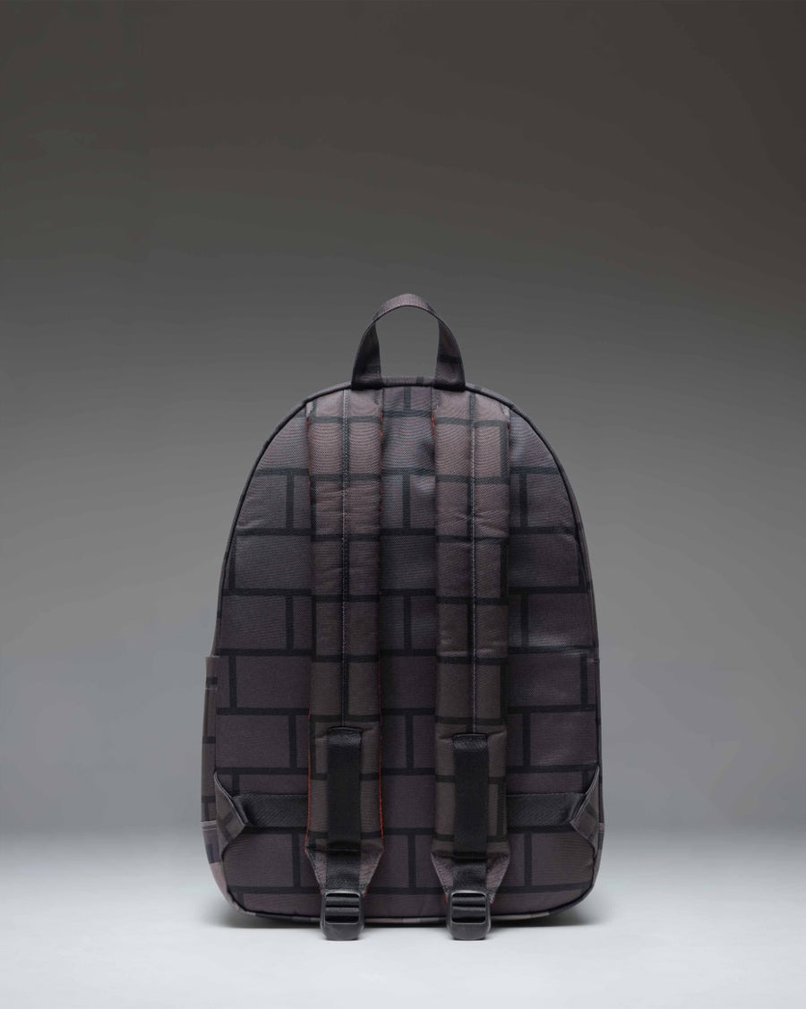 Minecraft Herschel Classic Backpack in The Nether colorway, featuring a pixelated red and black pattern inspired by the video game.