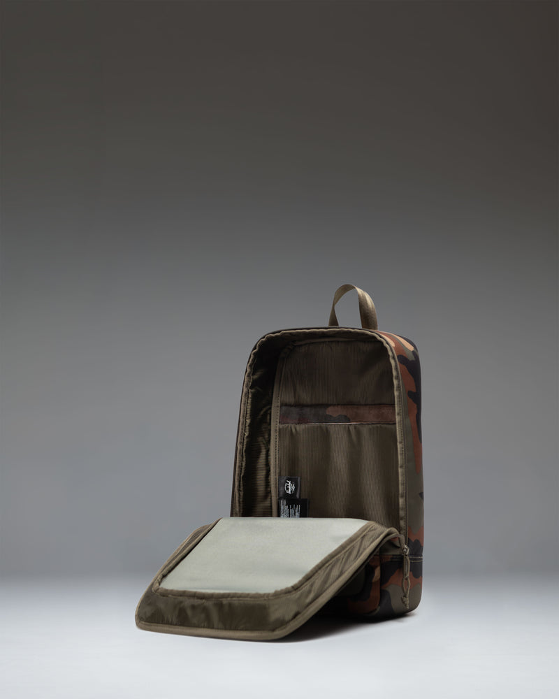 Herschel Heritage Shoe Bag in Woodland Camo camo pattern, featuring a zippered main compartment and a convenient webbed carrying handle.