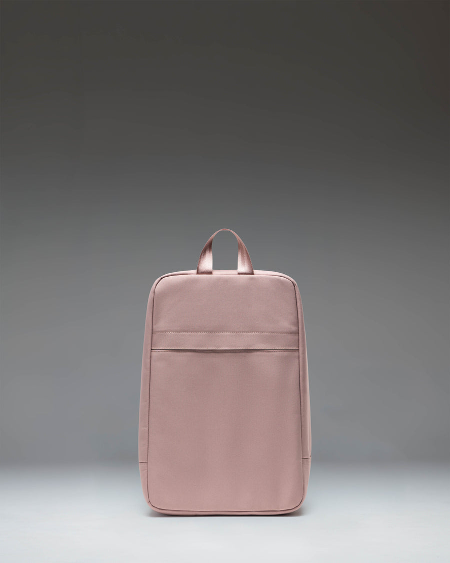 Herschel Heritage Shoe Bag in Ash Rose pink, featuring a main zipper compartment and a convenient top carrying handle.
