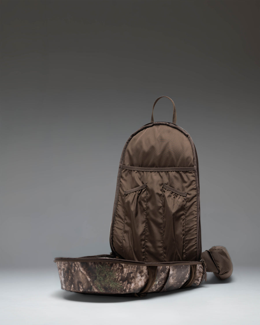 Herschel Supply Co. Realtree All Season Resort Backpack 14L in Realtree APX Camo pattern, showing a detailed product view.