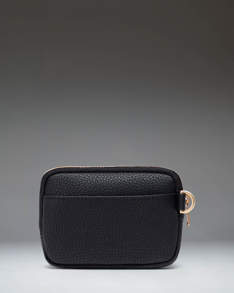 Herschel Supply Co. Oxford Pouch Vegan Leather in Black, showcasing a sleek, minimalist zippered accessory pouch.