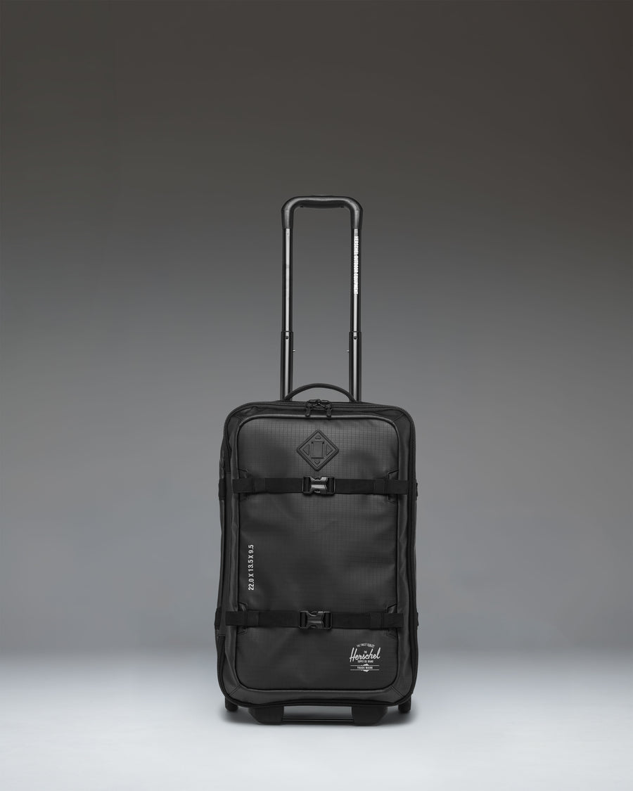 Herschel Supply Co. All Season Hybrid Roller Bag Large Carry On in black, showing the front exterior view of the luggage.