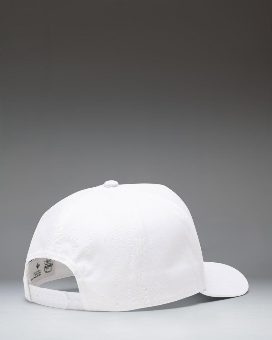 Herschel Supply Co Whaler Tall Cotton Paving Cap in white, showing a detailed side view of the adjustable strap and structured crown.