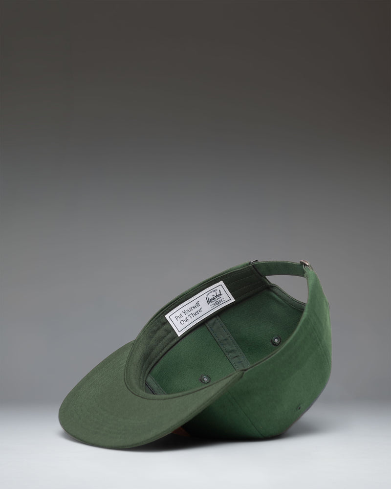 Herschel Supply Co. Scout Vintage Cap in Dark Green/Mountain View, showing the front view of the structured six-panel hat with a logo patch.