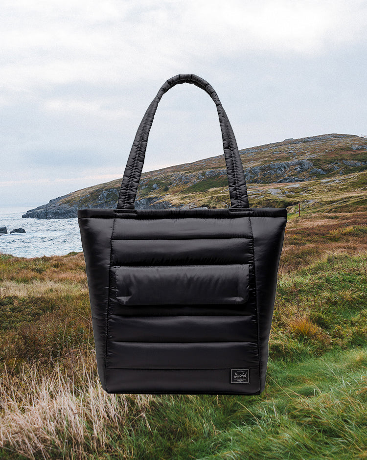 Black Herschel Retreat Tote shown from a front perspective on a white background.