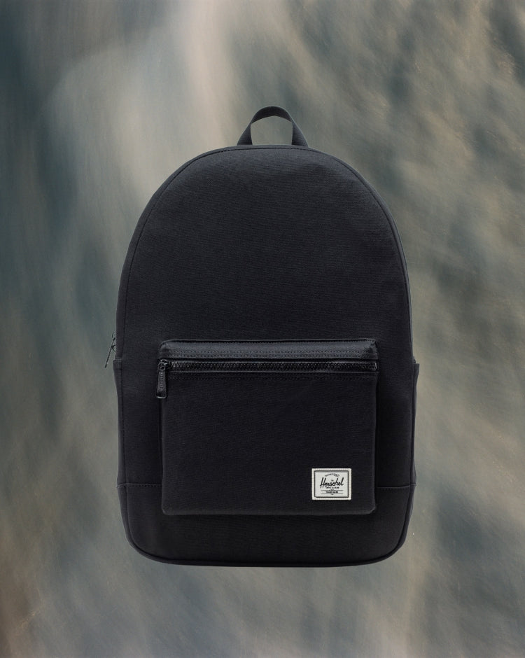 Herschel Supply Co. Pacific Daypack in black shown from the front against a neutral background.