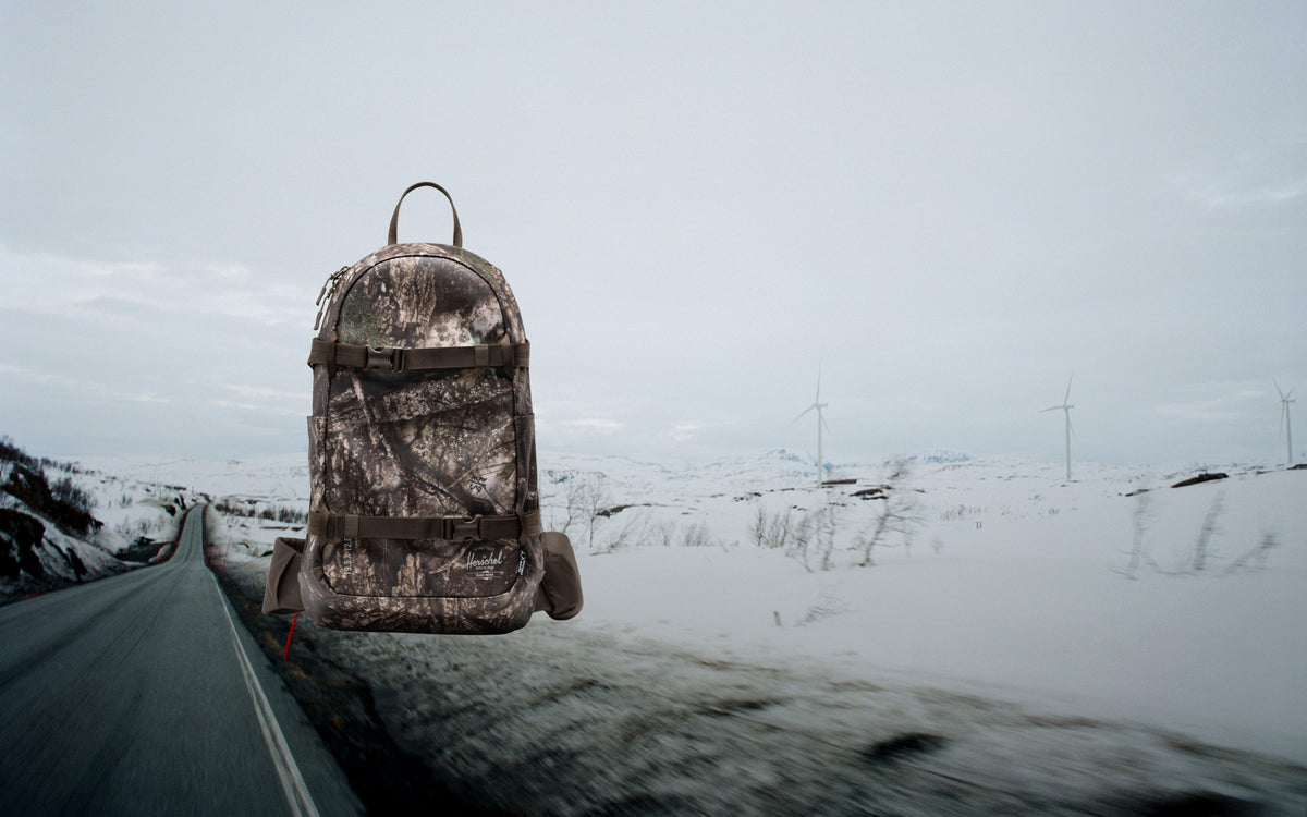 Herschel Supply Co. Realtree All Season Resort Backpack 14L in Realtree APX Camo.