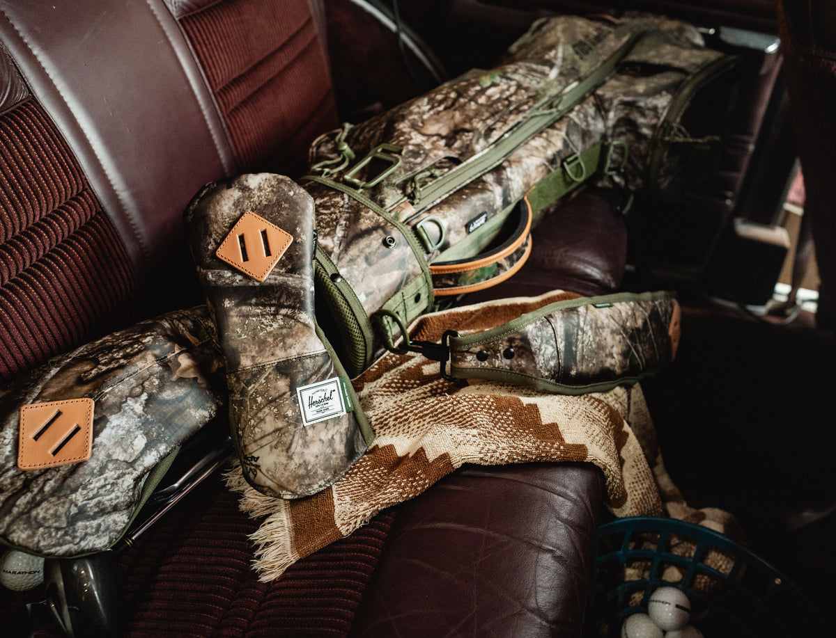 Herschel Heritage Hybrid Head Cover featuring the Realtree APX Camo pattern.