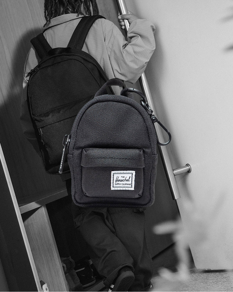 Herschel Classic Backpack Bag Charm in black, showing its miniature design modeled after the classic backpack.